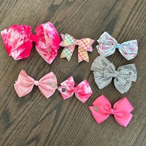 Lot of seven girls, hair, bows, some custom-made, some JoJo Siwa